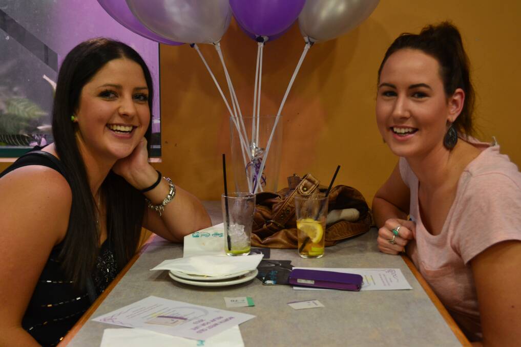 CELEBRATE: Kahlie Goddard and Thea Fletcher celebrate the Relay for Life launch with some drinks.