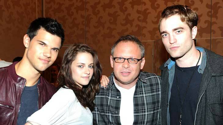 Team work: From left, <i>Breaking Dawn</i>'s Taylor Lautner, Kristen Stewart, director Bill Condon and Robert Pattinson.