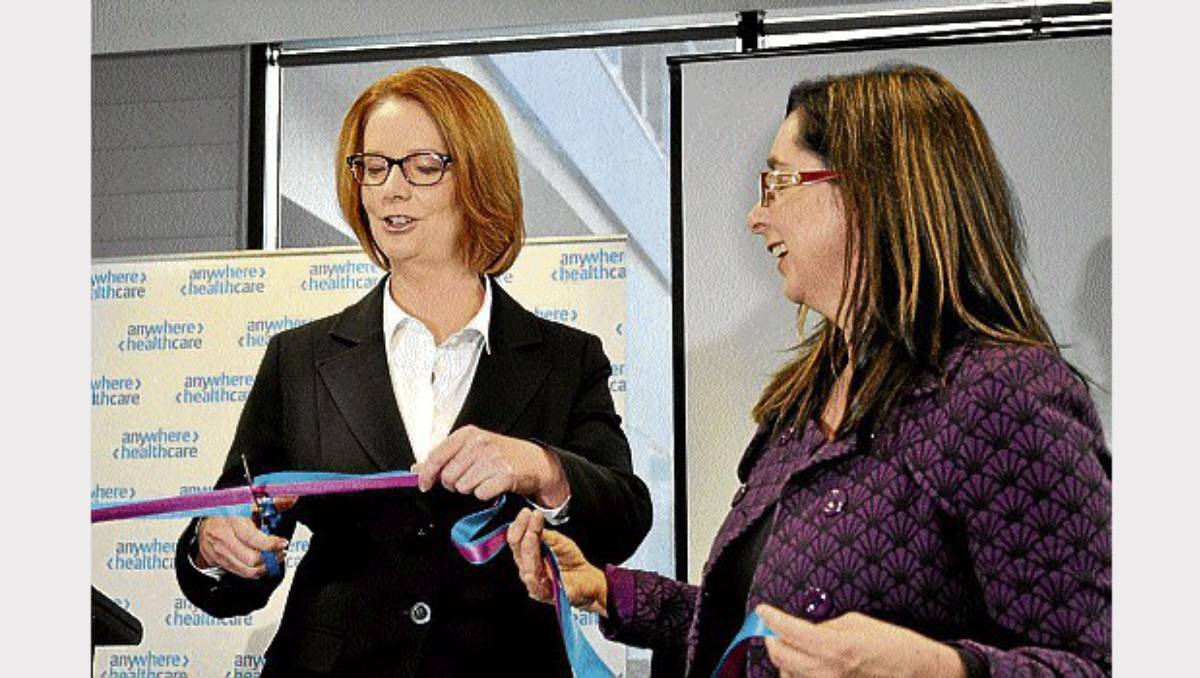 Prime Minister Julia Gillard and Tasmanian Health Minister Michelle O'Byrne cut a ribbon to open a "virtual healthcare" service. Picture: Ben McKay