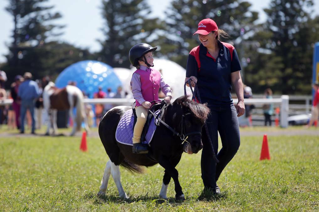 Bethany Dyson, 4, with her mum Sarah Dyson from St Helens riding Tia in the Under 6 rider class at the Port Fairy Show. Picture: DAMIAN WHITE