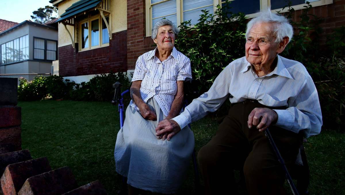 expert recommends pulling down part of an elderly Waratah couple’s house, removing their shed and excavating the whole yard to stop water from a disused coalmine inundating the property. Allen and Claris Watson, of Waratah, in the yard of their subsidence-affected home. Picture: Simone De Peak