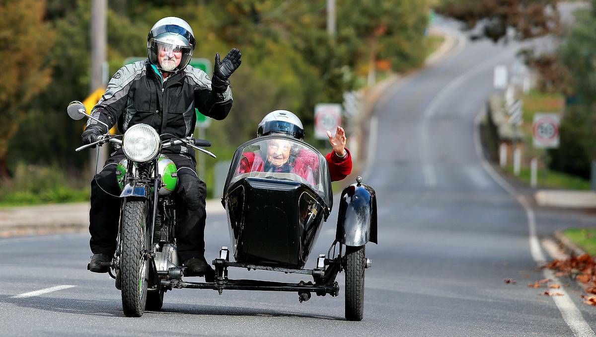 Jean Barton, 94, of Yackandandah in Victoria hitches a ride with Kevin Hammond in a sidecar attached to his 1937 VB Ariel 600. Picture: John Russell