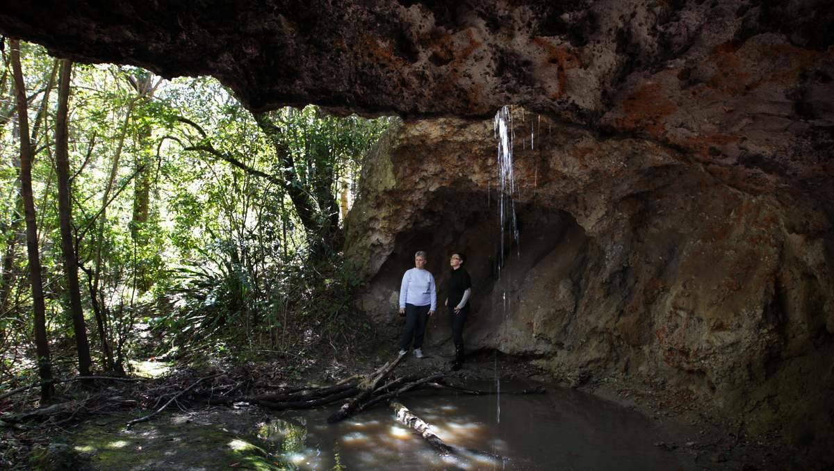  Resident Anne Andrews and Cr Jodie Harrison in the Butterfly Cave at West Wallsend, Lake Macquarie, which has been declared an Aboriginal Place. Picture Peter Stoop