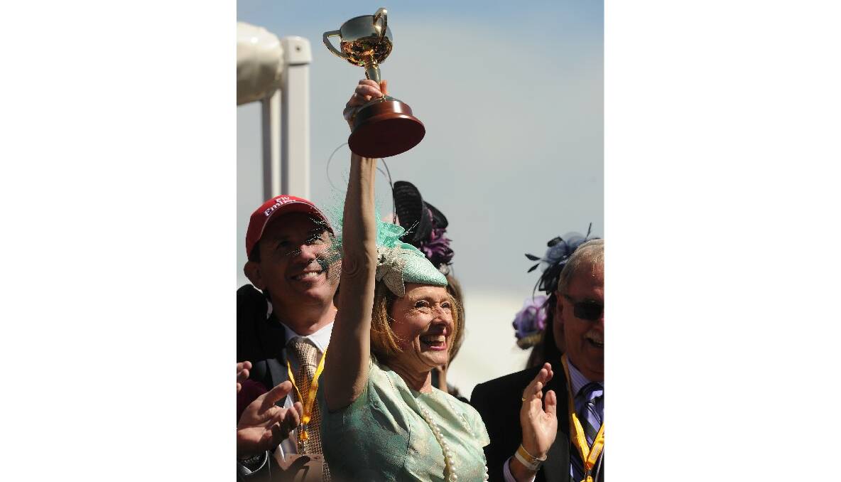 Melbourne Cup 2013. Happy trainer Gai Waterhouse holds her trophey after her horse Fiorente, won the 2013 Melbourne Cup. Picture by Sebastian Costanzo/The Age.