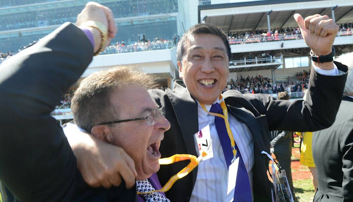 The 2013 Melbourne Cup was won by Fiorente ridden by Damien Oliver and trained by Gai Waterhouse. Two owners of the winner celebrate its victory. Picture by Pat Scala.