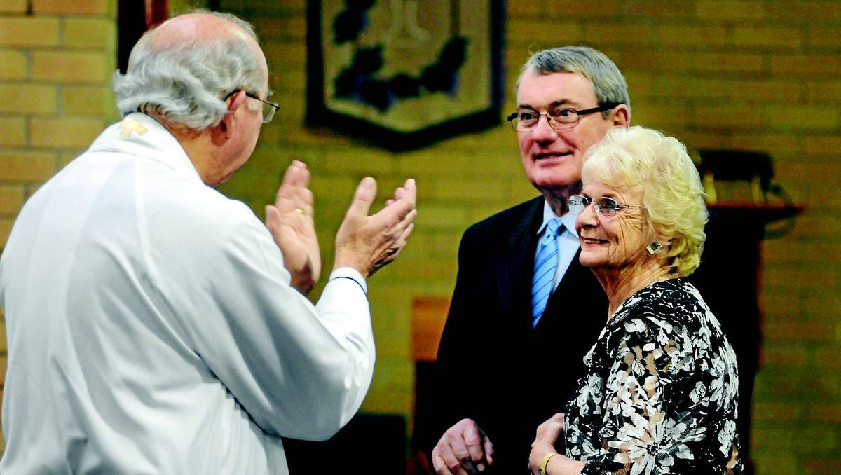 Reverend Gary Neville is the first to congratulate Alan Way and Patricia James after the couple were married yesterday, 33 years after they met. Picture: Steve Gosch.