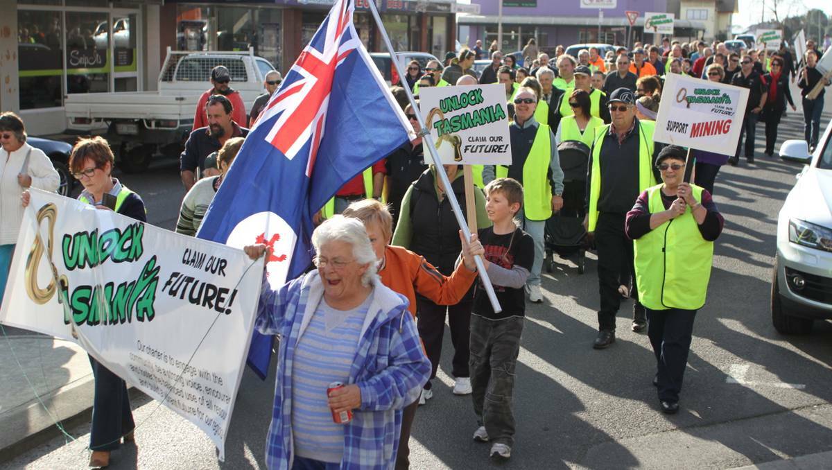 More than 100 people joined in the march down the main street of Smithton to show their support for the workers and their families at Ta Ann. Picture Grant Wells.