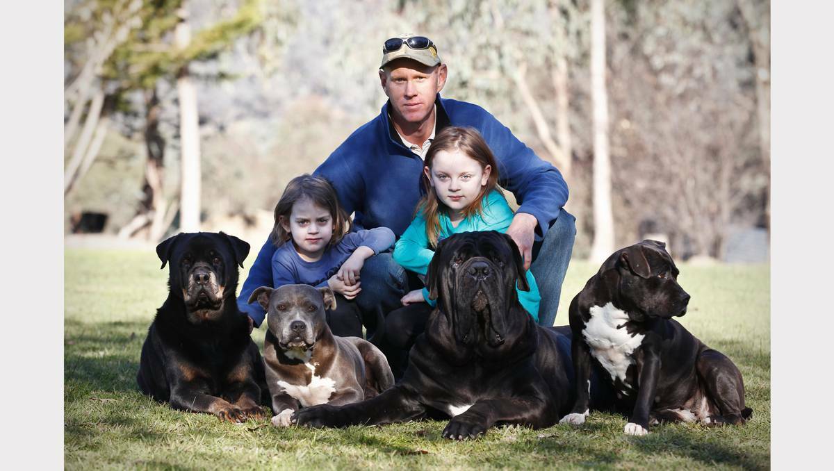  Dog trainer Scott Harris speaks about tougher dog laws with children Connor, 5, and Emily, 9, and dogs Tilly, Lexie, Theo and Bonnie. Picture: Ben Eyles.