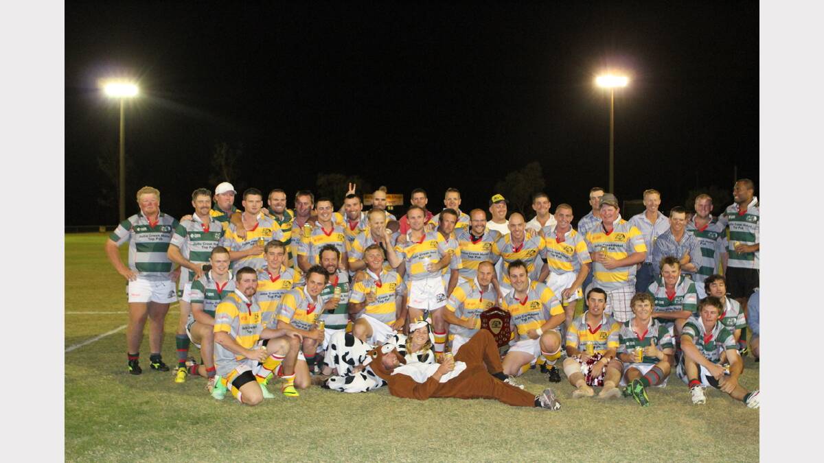 BROTHERS IN ARMS: Both Town and Country teams celebrate the resounding success of Friday night's match. 