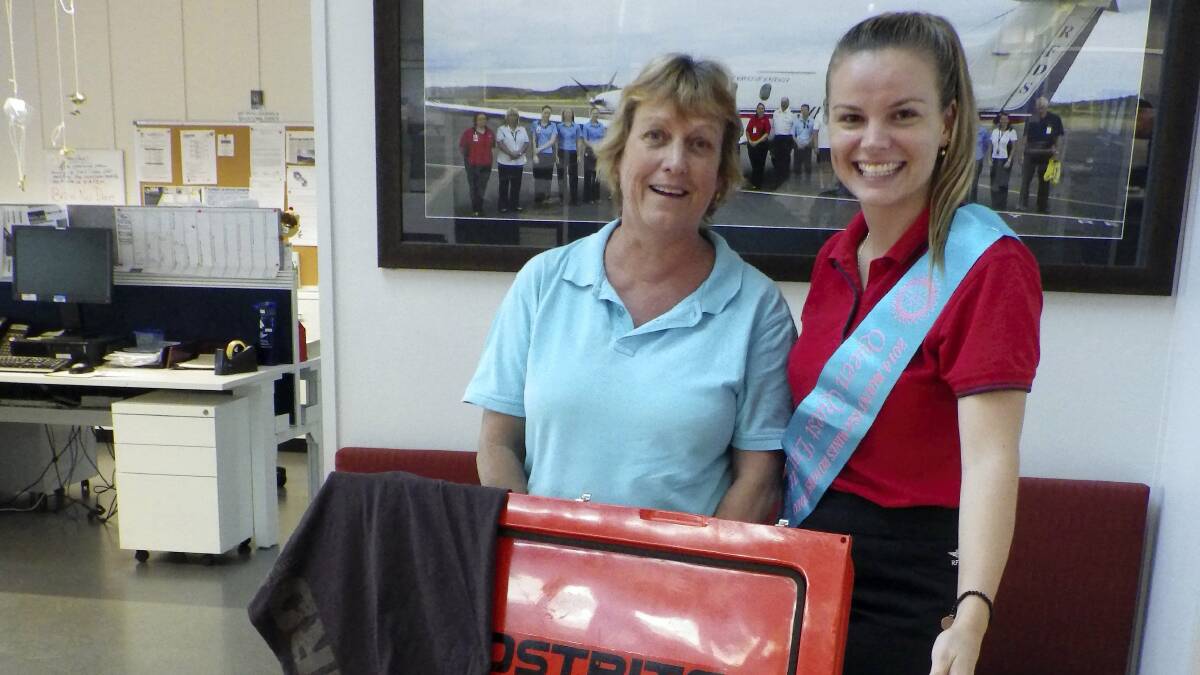 RAFFLE FUND-RAISER: Marjanne Vlaar, winner of an esky full of alcohol and promotional products, with Mount Isa Mines Rotary Rodeo Queen Quest entrant Tegan Kastermans.