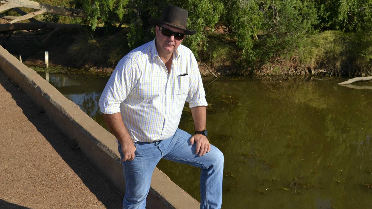 WATER TIGHT: Cloncurry Mayor Andrew Daniels at the weir in November last year. The extension will capture precious water at Chinaman Creek Dam.