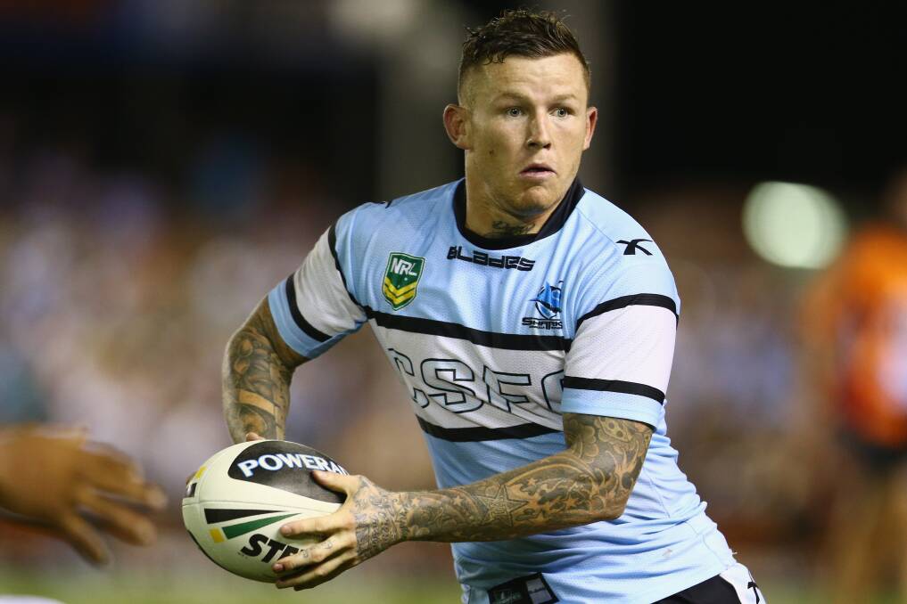 Todd Carney of the Sharks runs the ball during the round one NRL match between the Cronulla Sharks and the Gold Coast Titans. Photo by Mark Kolbe/Getty Images