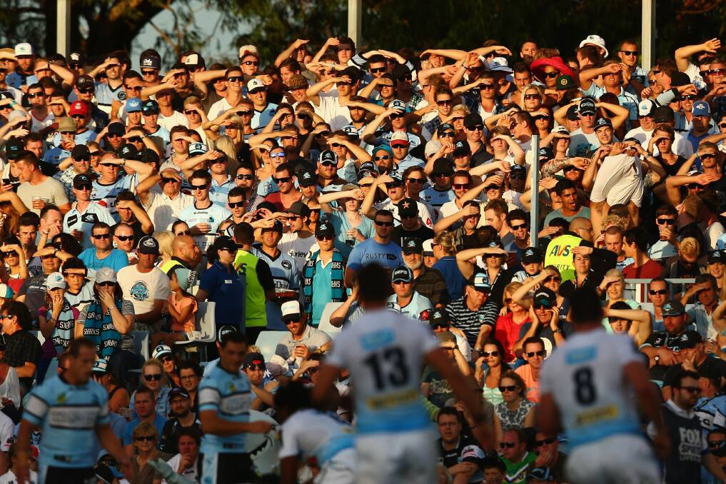 The crowd watch on during the round one NRL match. Photo by Mark Kolbe/Getty Images