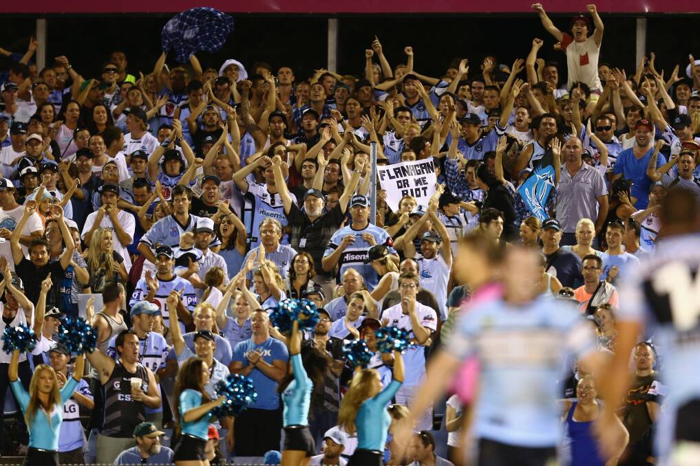 The Sharks supporters celebrate winning the round one NRL match between the Cronulla Sharks and the Gold Coast Titans. Photo by Mark Kolbe/Getty Images