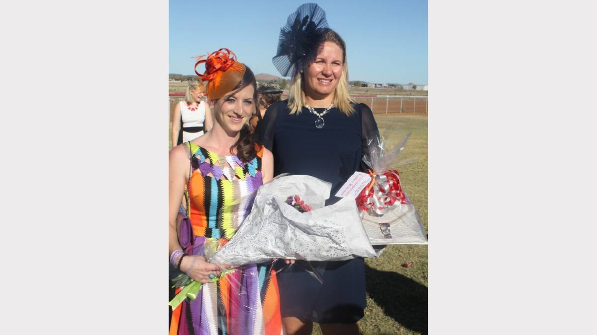 MODERN LOOK: Contemporary fashions on the field winner Kim Ballinger accepts her prize from Brooke Abdy.