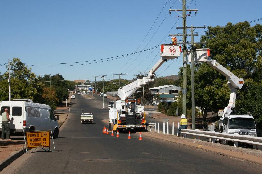 TROUBLE SPOT: Ergon workers work on solving the problems with Mount Isa’s power supply yesterday.