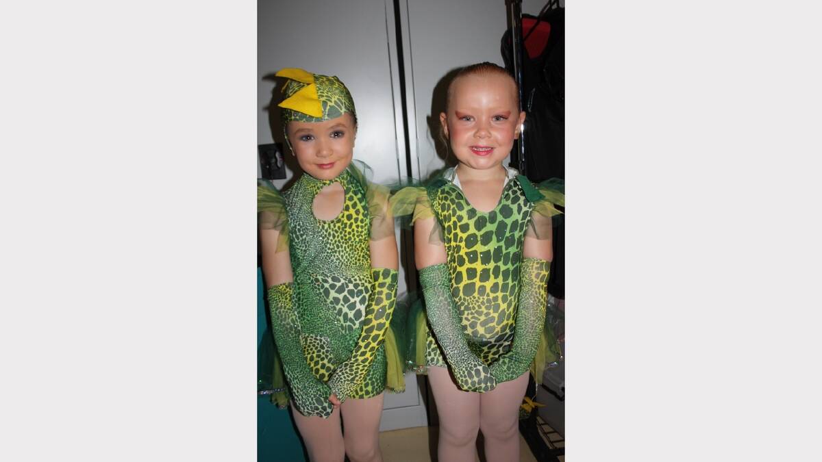 GREENIES: Kayla Woodsby, left and Emy Hopkins, 5, prepare to go on stage.