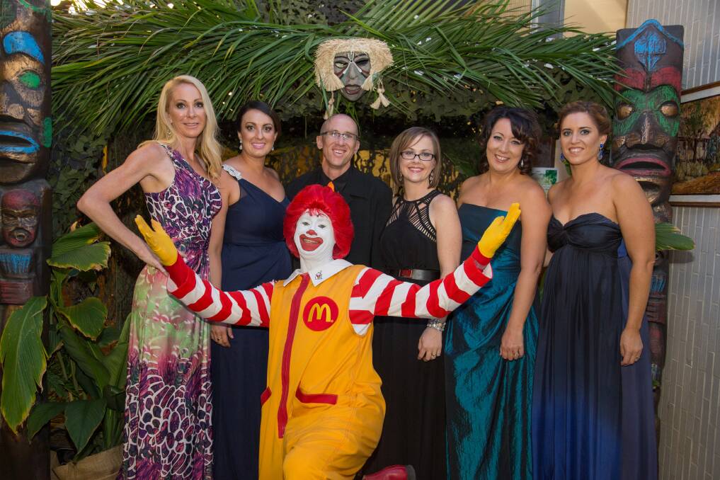 TEAM EFFORT:  Glencore Mount Isa Ronald McDonald House NQ Charity Ball committee members with Ronald McDonald enjoy the fruits of their labour.
