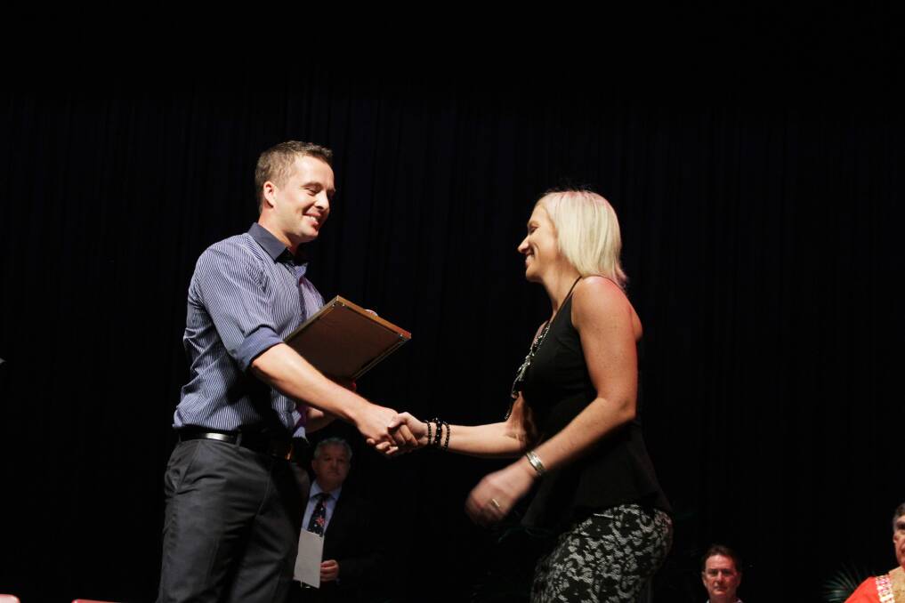 SENIOR SPORTS PERSON: Amanda Gowing is presented with an award for her commitment to sports. 