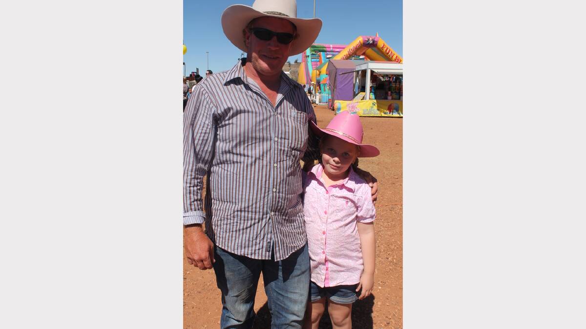 PRETTY IN PINK: Decked out for rodeo are Jay Smith and Hayley Smith, 7.