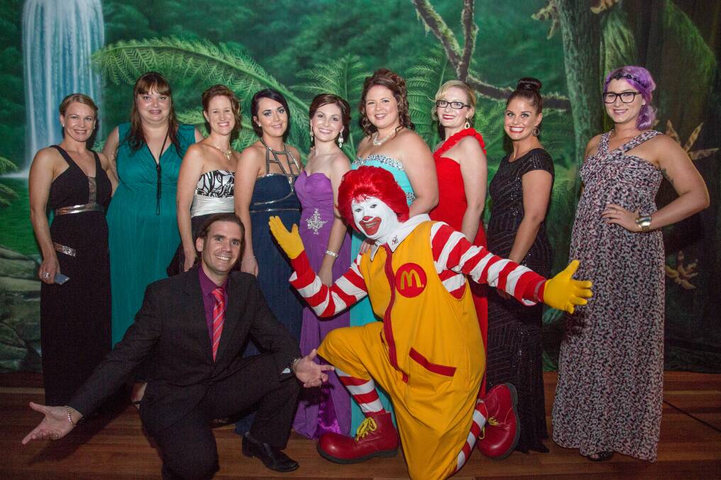 PARTY TIME: The team from Wardle and Associates enjoy a night out with Ronald McDonald.