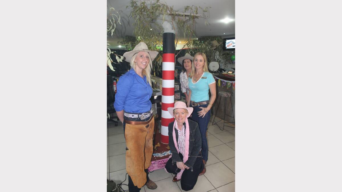 SMOKING STACK: Karlyn Rogers, Brenda Slade, Leesa Fanti and Katrina Gall from Vivid Realty re-created the iconic Mount Isa Mine smoke stack in their shop - complete with billowing smoke on command. - Picture: HAILEY RENAULT/7816