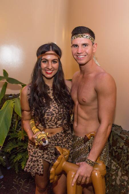 JUNGLE COUPLE:  Maddison Martin and Charlie Cross have a roaring great time at the ball.
