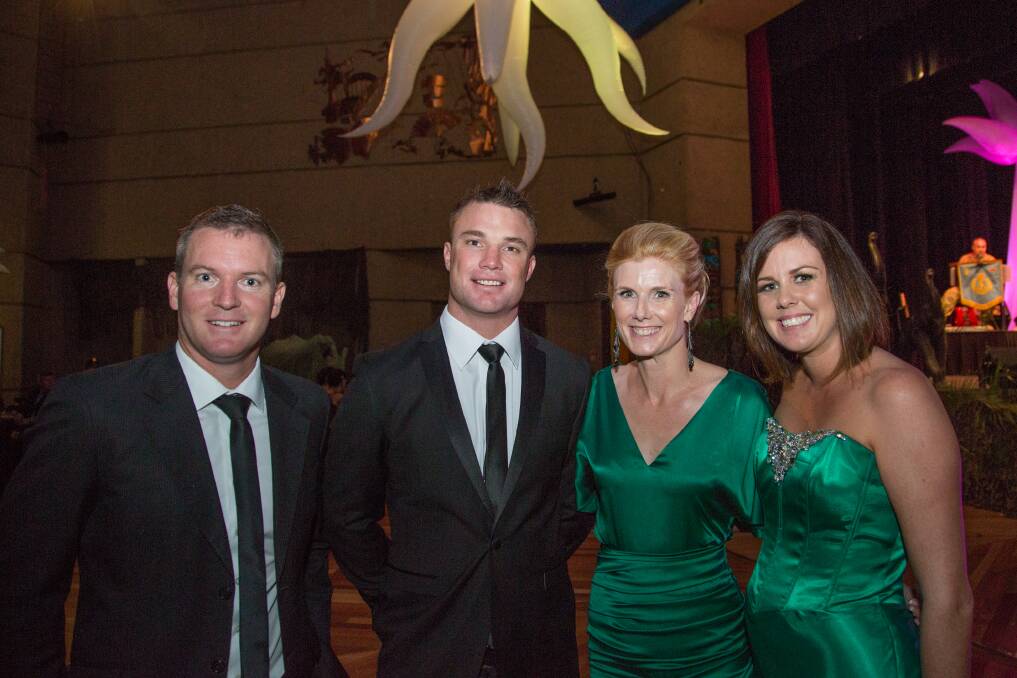 GIRLS IN GREEN:  Paul Rissman, Greg Mallinson, Carolyn Townsend,  and Lisa Hurst catch up at the event of the year.