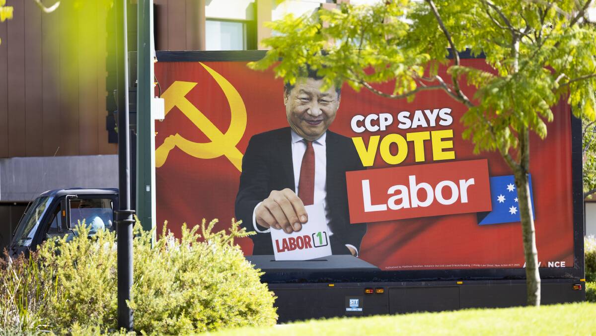 An anti-Labor advertisement seen during a press conference in Perth in April. Picture: Getty Images