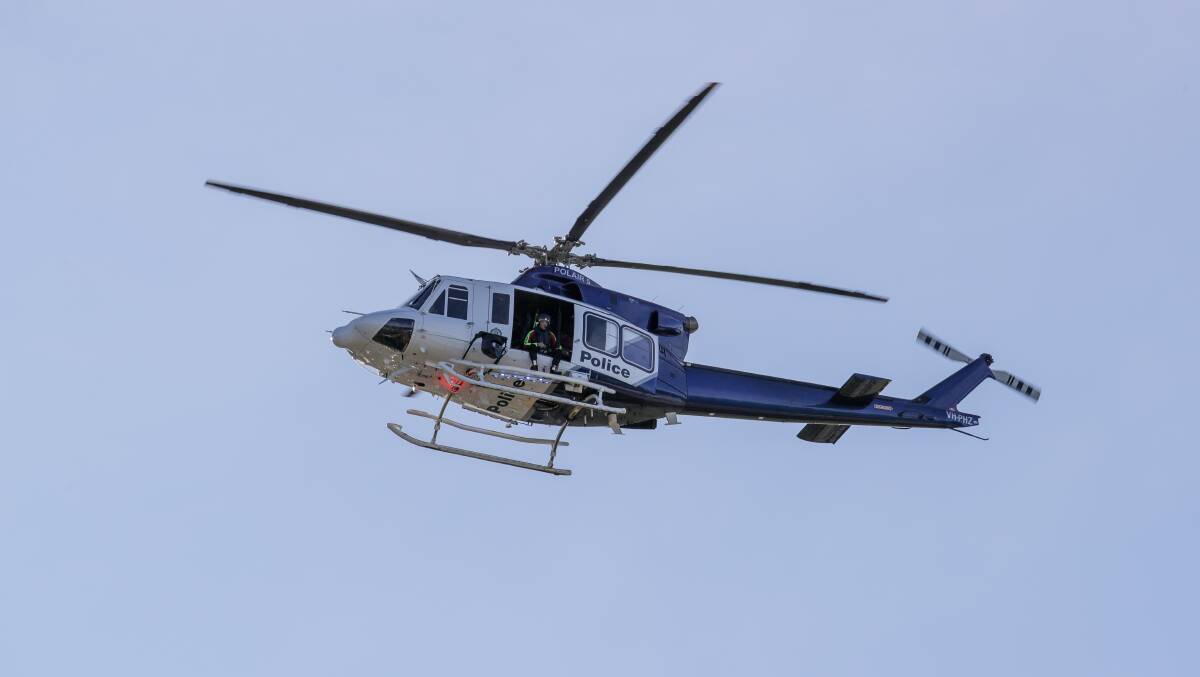 Polair police helicopters search for a missing person. Picture by Adam McLean.