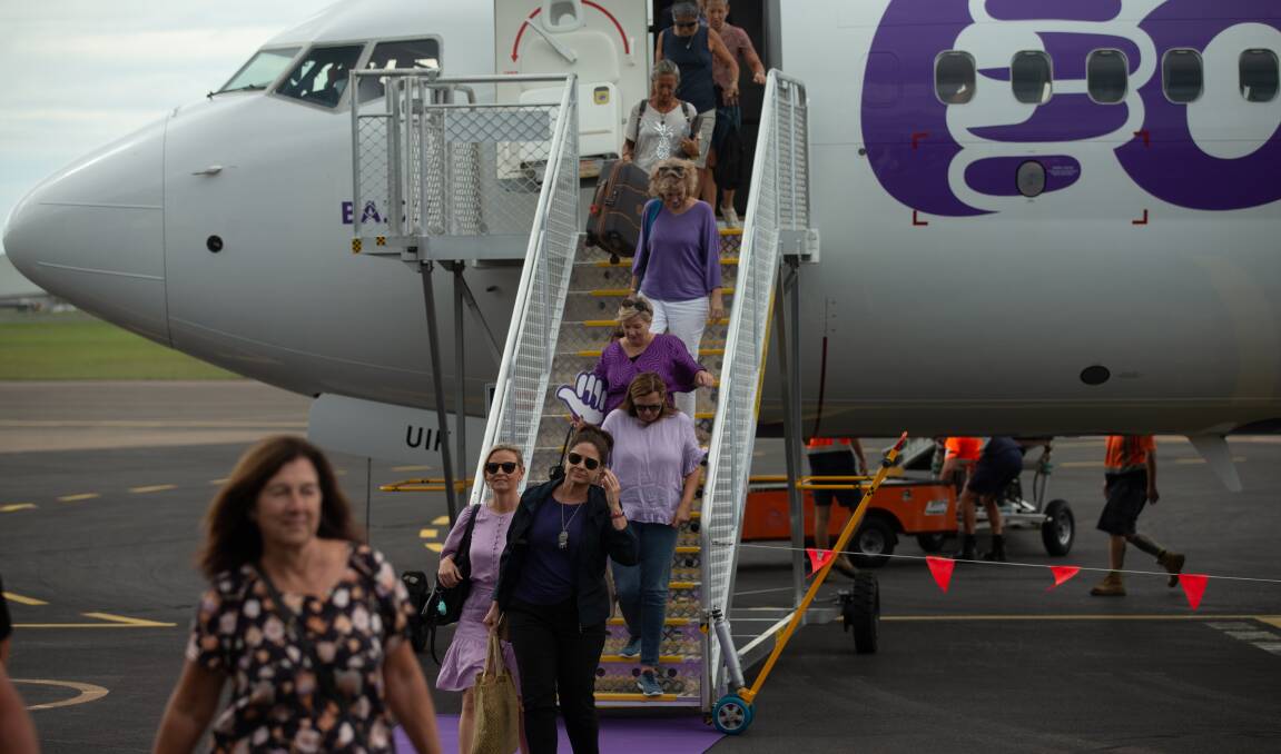 Customers disembark Bonza airlines' inaugural flight from the Sunshine Coast into Newcastle Airport in March, 2023. Picture by Jonathan Carroll.