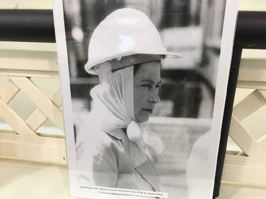 A photograph of the Queen in a hard hat while touring Mount Isa Mines. The photograph was credited to The Daily Telegraph and decorated an accession day morning tea held at the Mount Isa City Library on Monday. The North West Star published a similiar photograph.