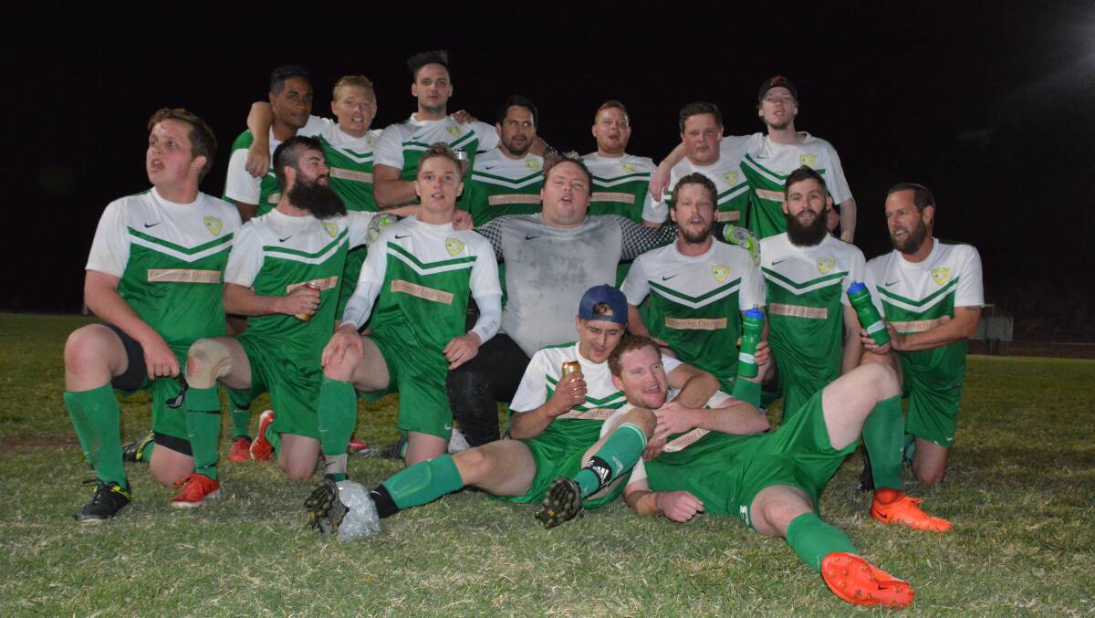 CHEERING: The Parkside boys rally around to celebrate with a group shot after their 2-1 victory against Atlas in the grand final. Photo: Chris Burns. 