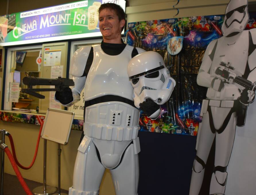 "These aren't the droids we're looking for": Mount Isa Star Wars enthusiast Tyler Harris play acts at the Mount Isa Cinemas. 
