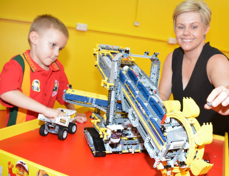 LEGO LOVE: Matthew Bimrose, 6, and his mother Cathy play with a moving Lego piece. It took 15 hours to build the bucket wheel escavator. 