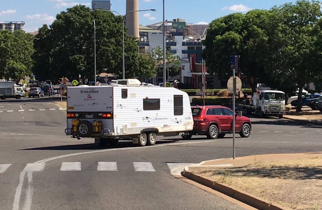INDICATING: A car towing a caravan turns into Marian Street near the central business district. Photo: Chris Burns. 