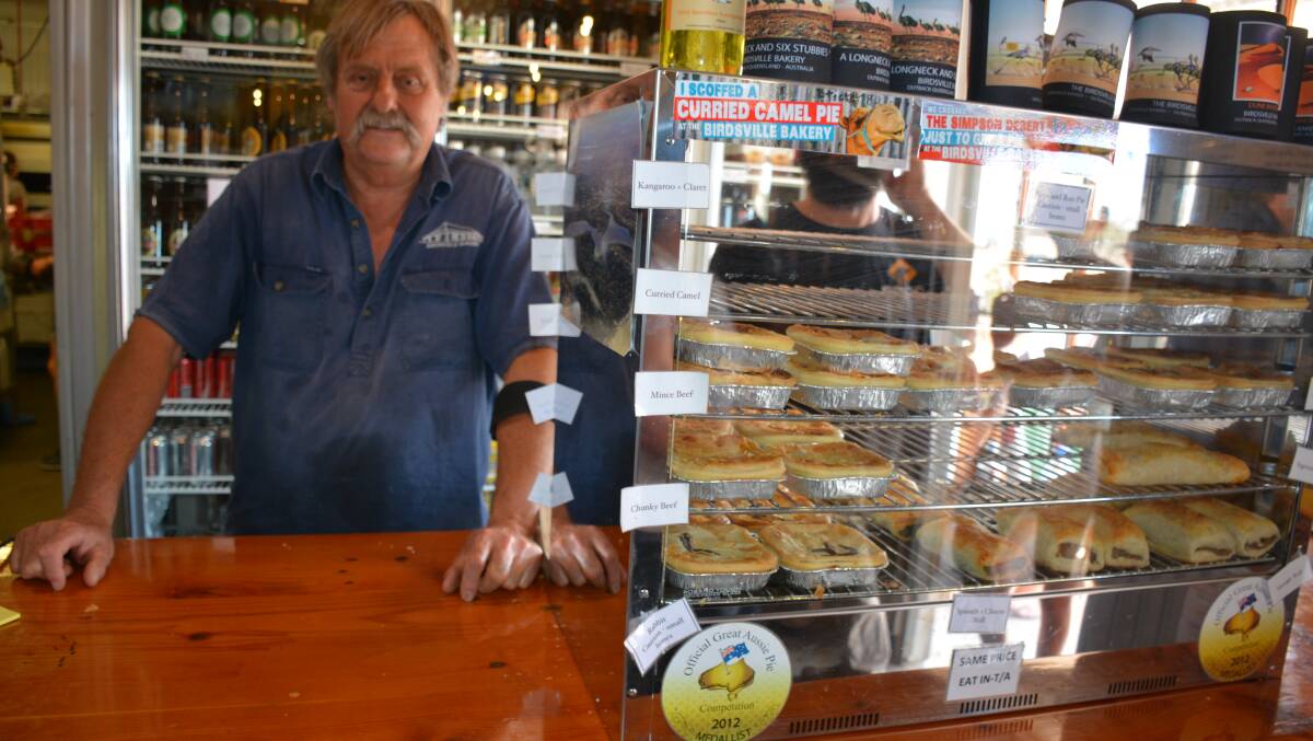 Working hard: Birdsville Bakery owner Dusty Miller works behind the corner of the busiest day of the year. It is the Saturday of the Birdsville Cup. 