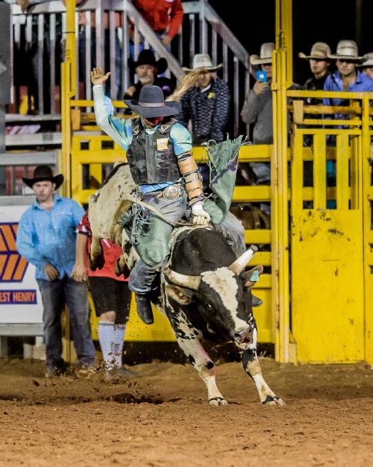 THRILLS AND SPILLS: Tristen Braden rides high on bull Colour of Money during the 2017 Curry Merry Muster. Photo: Supplied 