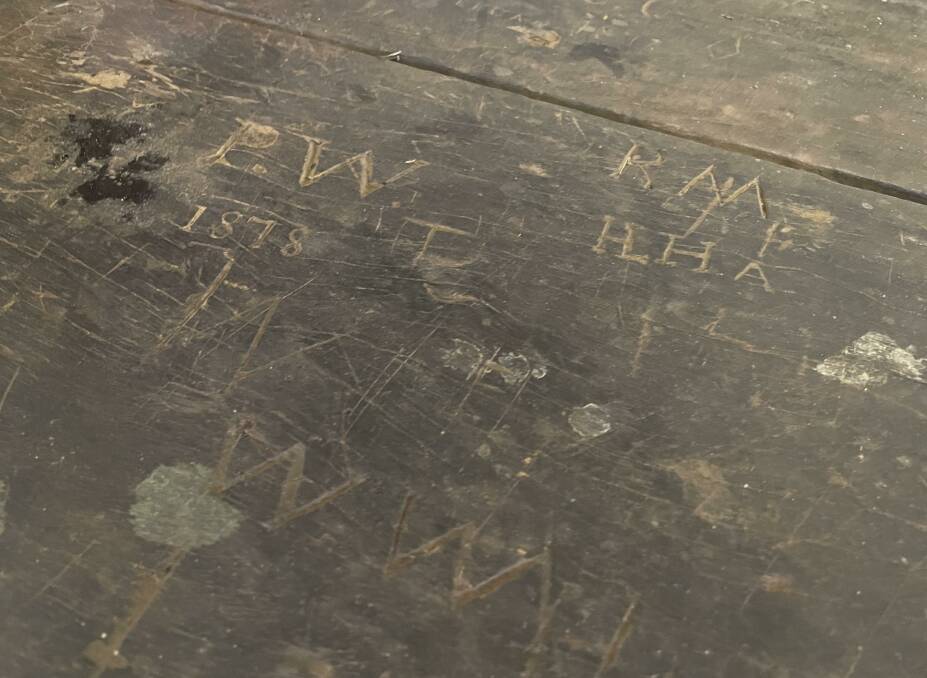 Century-old carvings on the original shearers' quarters table date back to when the alleged crime took place.