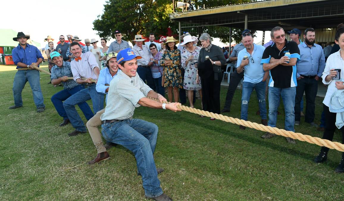 The blokes showing off their strength in the tug of war held as part of the Richmond Race Day festivities.