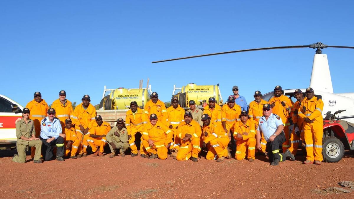 Gavin Fryar, front second left, at a Mornington Island shed installation. Picture supplied.