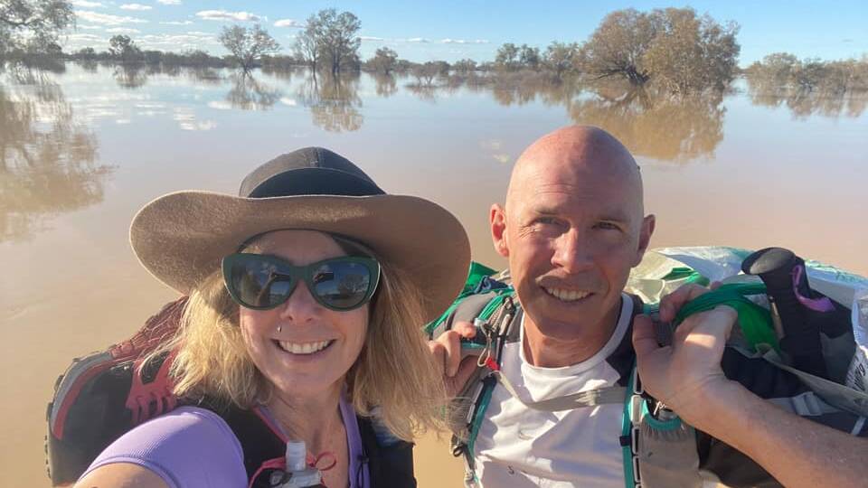 With hydration vests and running shoes slung over their shoulders, Vanessa Bond and Michael Greenep take the 'scenic SES river cruise' across the Diamantina.