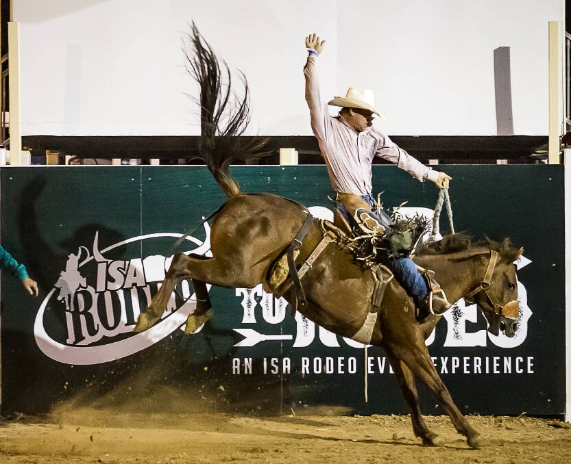 Injune cowboy Darcy Radel winning the 2nd division saddle bronc with a 71 point ride before going on to win the open saddle bronc. Picture supplied.