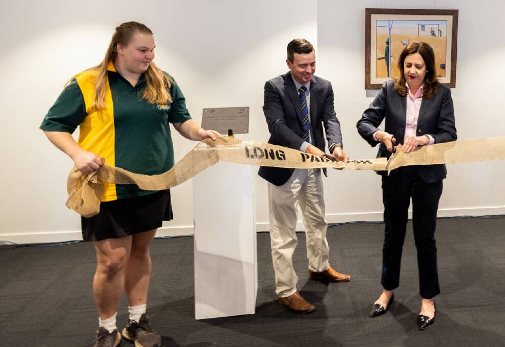 Barcaldine Mayor Sean Dillon assists Premier Annastacia Palaszczuk cutting the ribbon to open the revamped Australian Workers' Heritage Centre. The speaker's lectern has been crafted from Tree of Knowledge timber. Photo - Aaron Skinn.