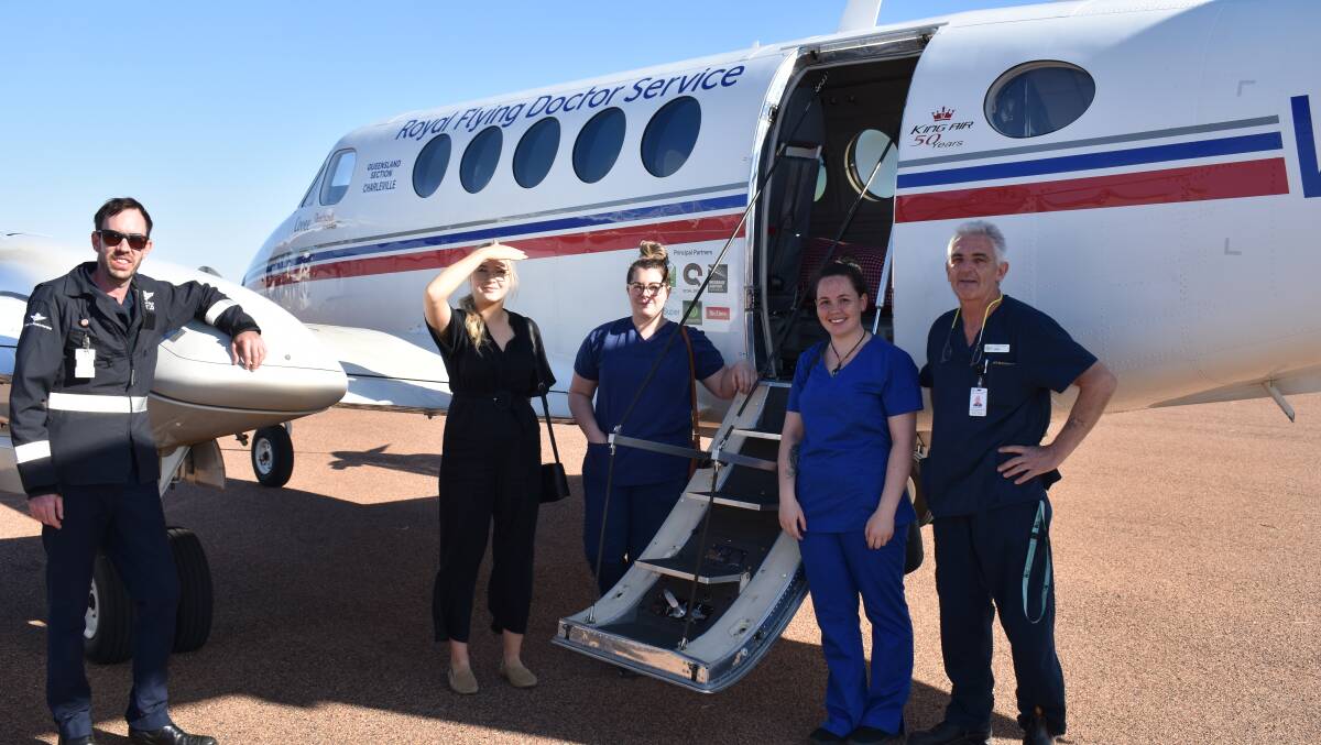 The Central West Hospital and Health Service and Royal Flying Doctor Service delivering Pfizer vaccines to Aramac last week, where it was transported to the shire hall by the Queensland Ambulance Service, highlighting the cooperative approach employed in western Queensland. Pictured are RFDS pilot Andrew Hotham and the CWHHS immunisation team Rochelle Ballard, Gemma Grant, Jodie Stevenson and Mike Aleckson.