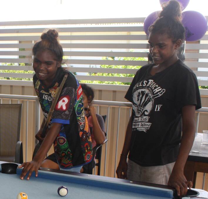 YOUNG PEOPLE AHEAD: Visitors to Mount Isa Youth Shelter Open Day Tracey Nemo (14) and Kiarna Nemo (13) enjoy a sisterly game of pool on the deck. Photo: Esther MacIntyre