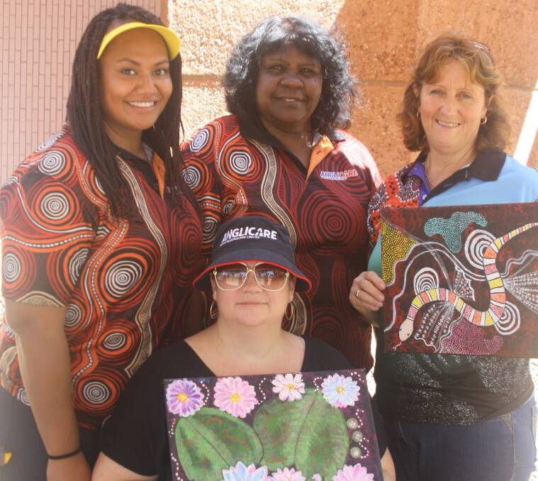 ART WORKS: Anglicare workers Saberina Gasio, Jodi Martyr, and Deb Mellor with Kalkadoon artist Barbara Sam (back middle) show off their creations at Closing the Gap day. Photo: Esther MacIntyre