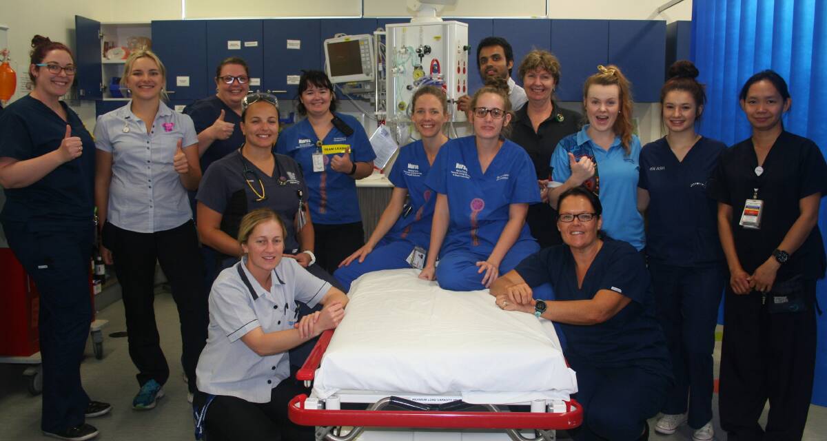 ED NURSING: Nurse Unit Manager of Mount Isa’s Emergency Department, Andrea Wallace (seated right front) with some of her team of emergency nurses. Photo: NWHHS