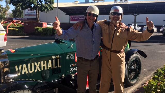 GOOD VINTAGE: Co-pilot Mark Johnson and driver Andrew Cannon with the 1923 one-of-a-kind vintage Vauxhall car, outside Red Earth Hotel in Mount Isa. Photo: supplied