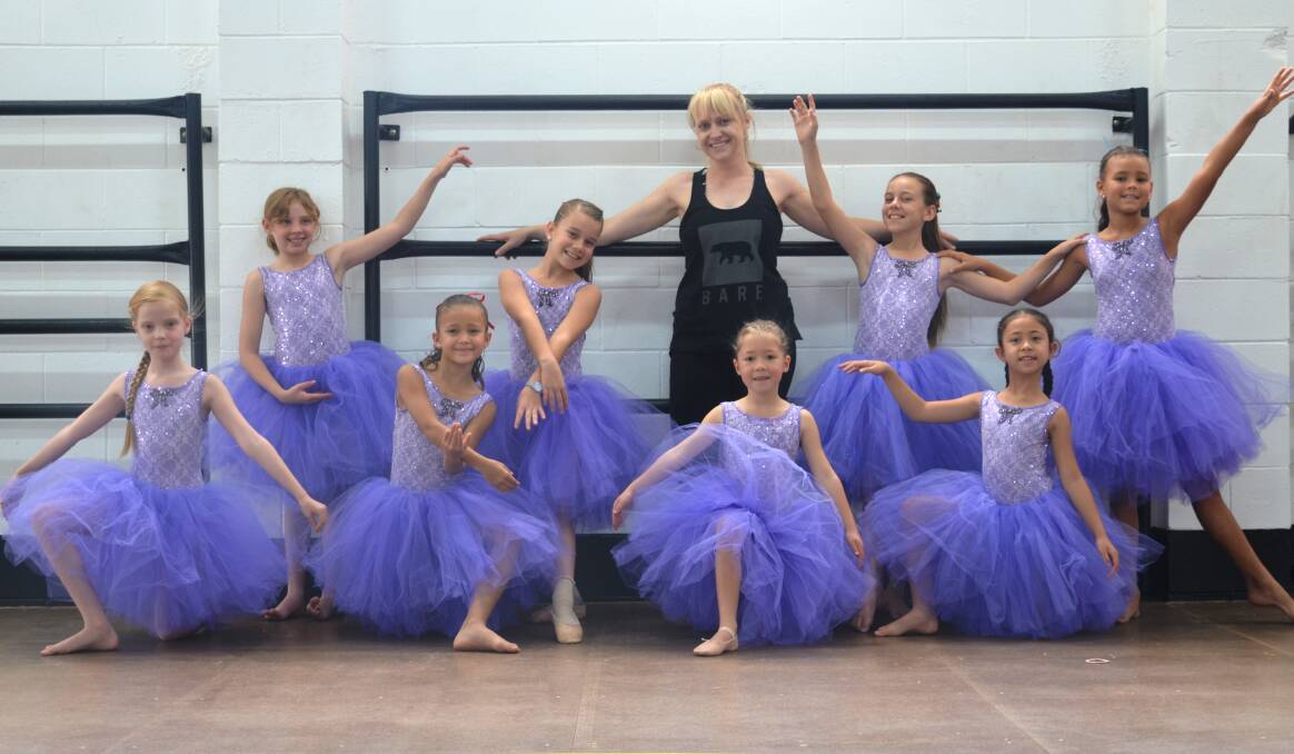 SALLY'S STARS: DiLi founder and teacher, Sally Prendergast, with one of her Saturday dance classes wearing a new shipment of tutus. Photo: Esther MacIntyre
